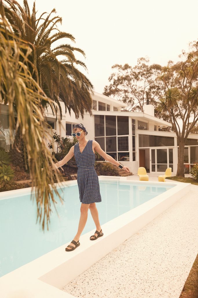 Woman walking by a pool